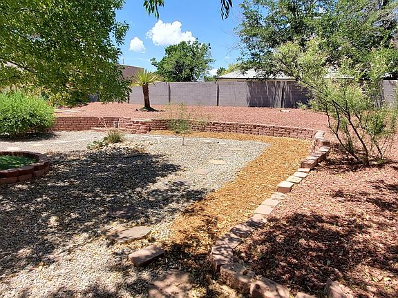 Nicely landscaped private yard perfect for hanging out with friends and family and sipping a Pina Colada.