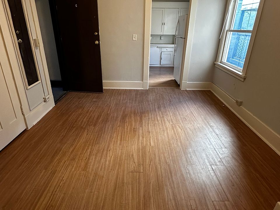 Dining room with kitchen in background