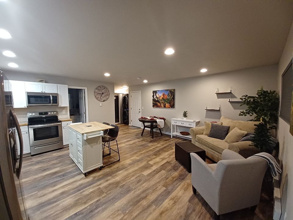 Open floor plan with kitchen, dining, and living room