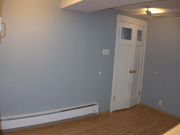 Living area with private doors to entry way