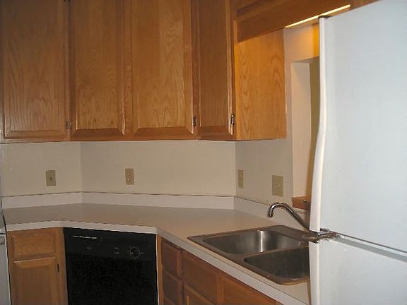Kitchen has plenty of cabinetry and counterspace to prepare meals 