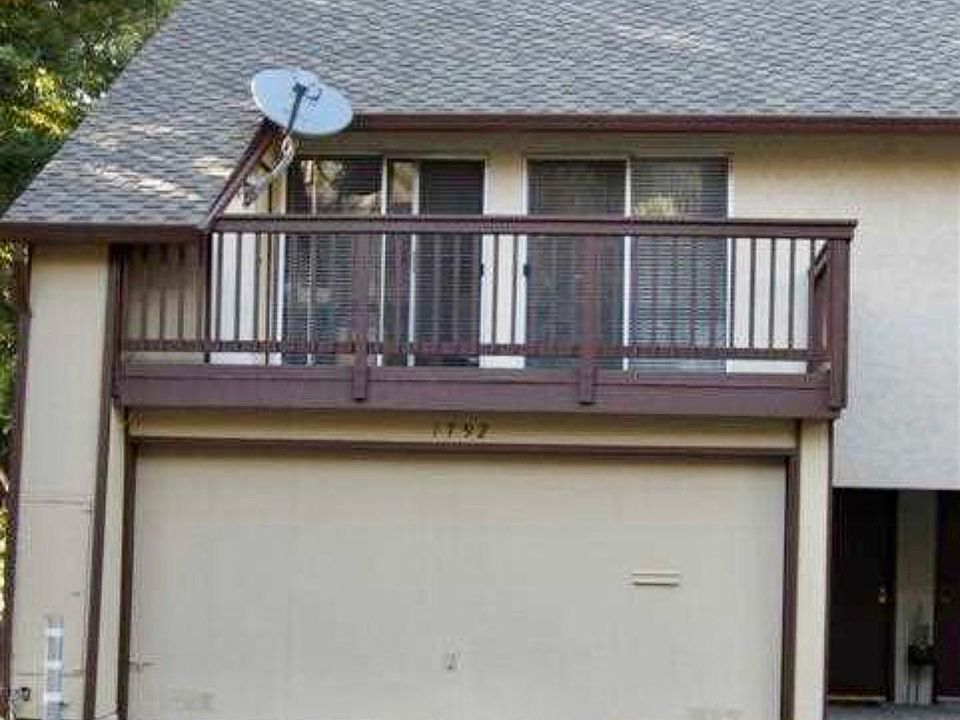 Front of the House. 2 bedrooms with sliding doors share this balcony.