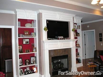 Fire place in living room : Ventless gas logs with remote controls.