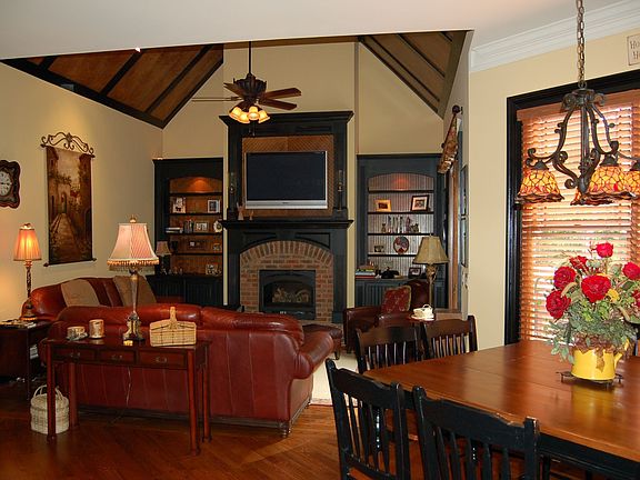 Keeping Room with Heatilator Brick Fireplace, Stained and Black Trim