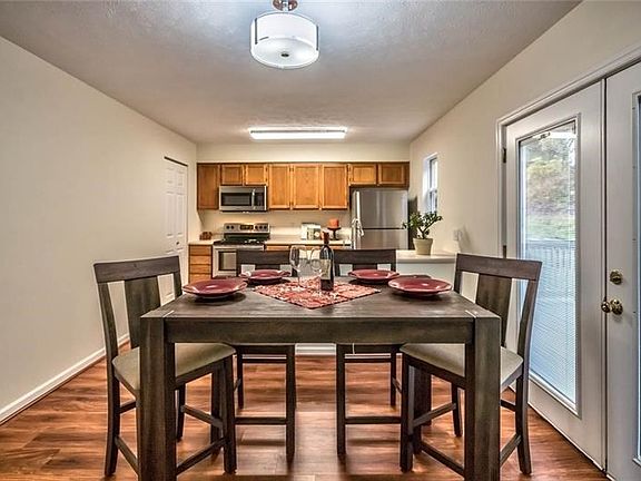 Gorgeous open kitchen overlooking the back deck and woods.  Notice the beautiful brand new flooring.