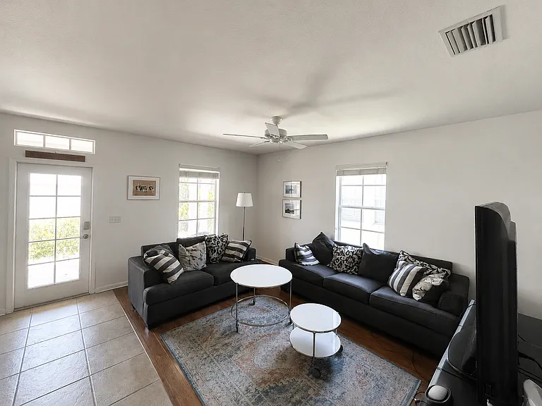 After going past the foyer you will see the living room to the right and kitchen to the left.