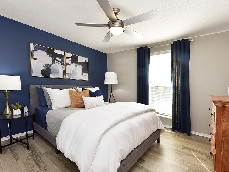Bedroom with hardwood-style flooring