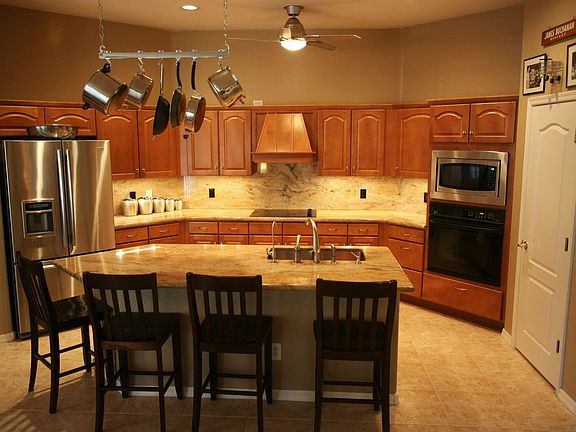 Highly upgraded kitchen w/ granite countertops and full granite backsplash