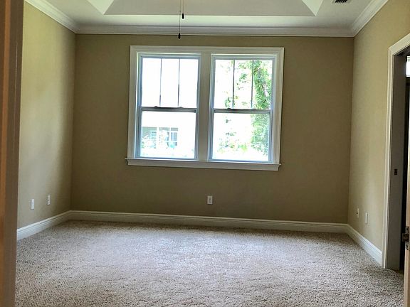 Master bedroom with beautiful tray ceiling