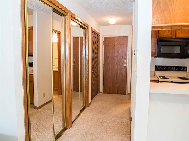 Stay organized from the moment you walk in with mirrored closets, hallway storage, and direct kitchen access.