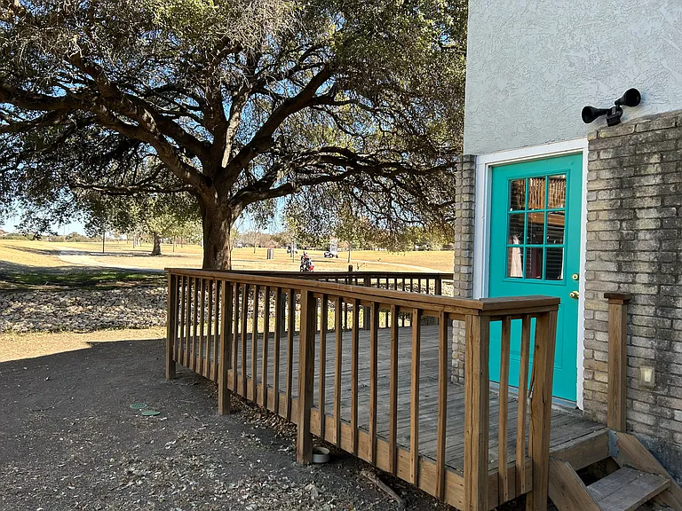 Exterior door from the living room to the lower deck.