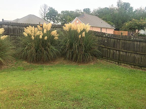 Beautifully landscaped fenced back yard.