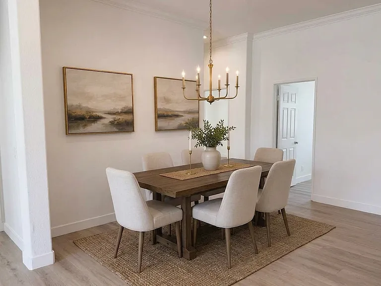 Dining Space Virtually Staged. Right door leads to bedroom #3. Left door leads to bedroom#2