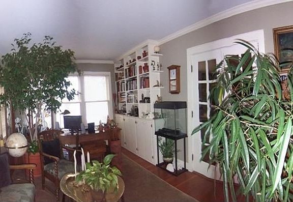 Wood Floors- Two Walls of Windows - French Doors - Built In Cabinets - Crown M