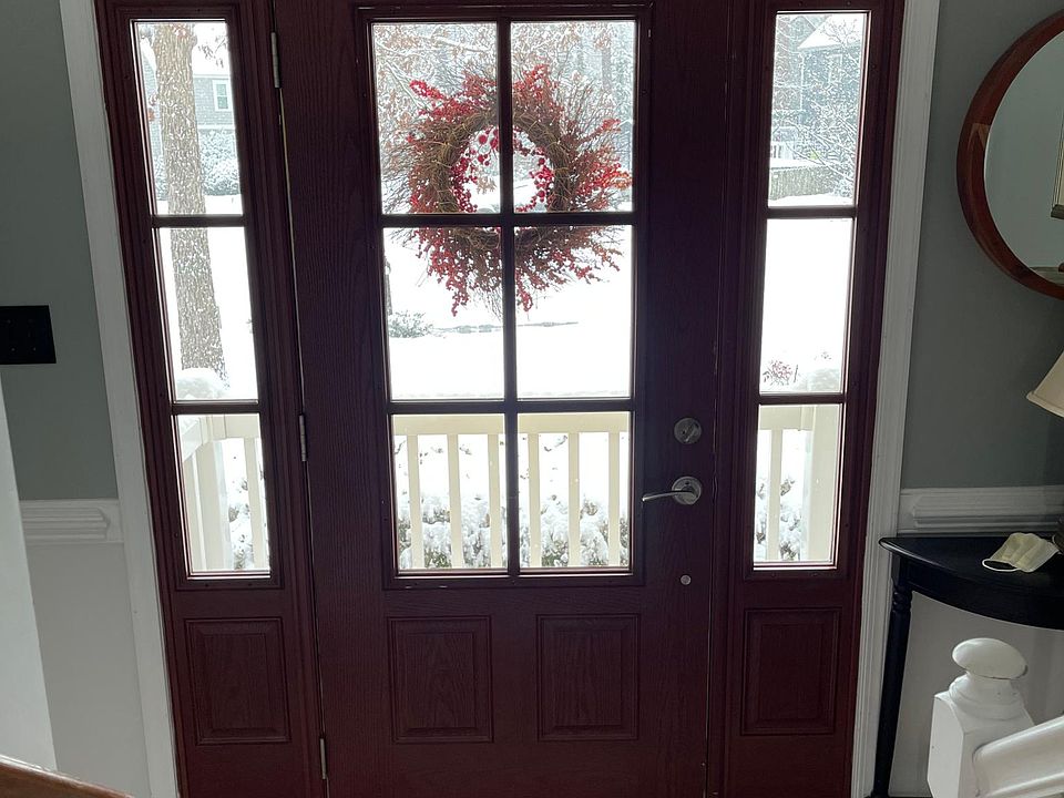 Front door. Brick, aggregate and vinyl entry. Aggregate sidewalk from driveway.