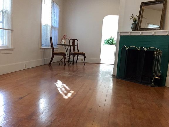 Living room to dining room showing fireplace