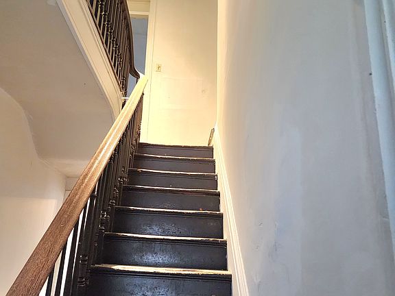 hallway leading up to bedrooms