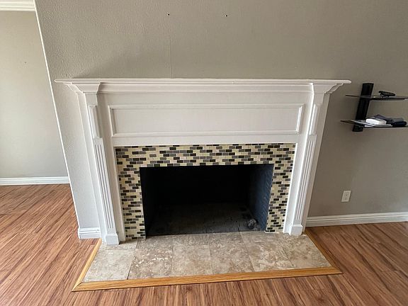 Fireplace. Front door entrance to the left.