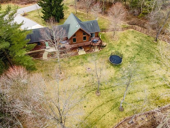 2 Acre 3 bedroom 3 bathroom home nestled in between Pretty & Big Long Lake