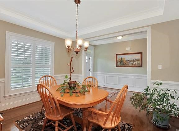 Dining room - plantation shutters, tray ceiling, beautiful woodwork!