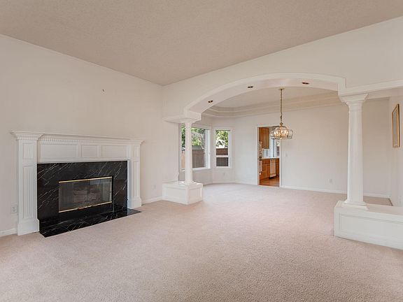 living room with formal dining area, fireplace.