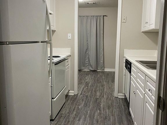 Galley style kitchen looking in to dining area