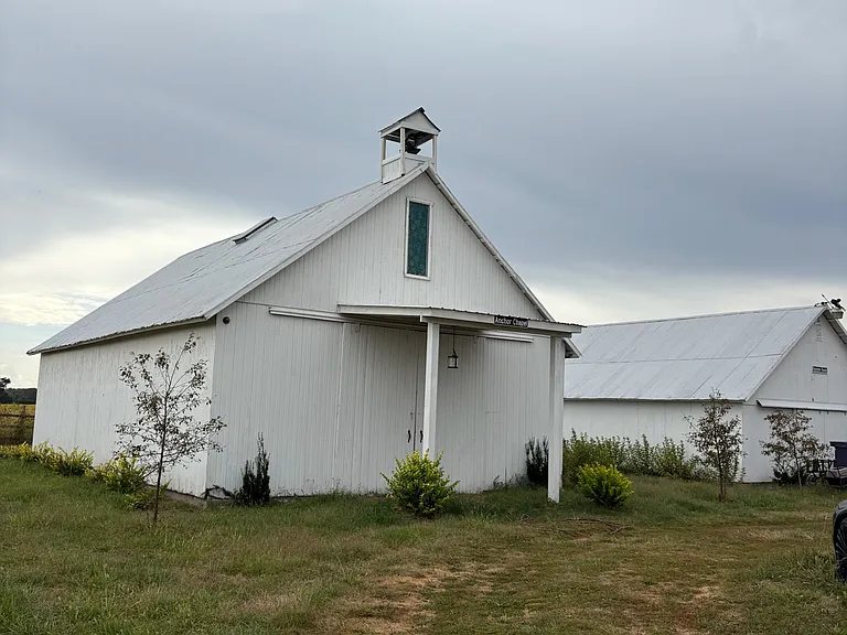 The Chapel or meeting room behind the Lodge and next to it is the Rooster Roost, a "man cave"