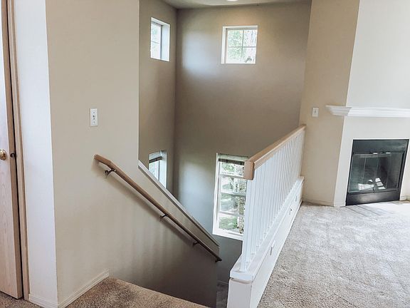 Townhouse style entry with staircase.