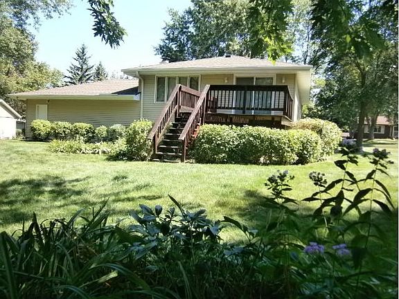 The yard features several perennial beds and a 15 x 11 deck for relaxing and entertaining.