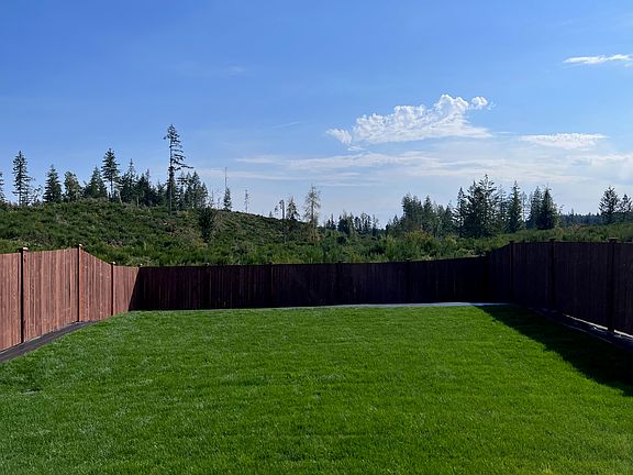 Flat and usable backyard (over 2,000 sq ft) with forest and valley views. Fully fenced.