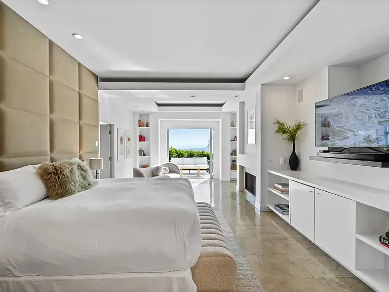 Enjoy the spaciousness of the primary bedroom, complete with a TV for entertainment.