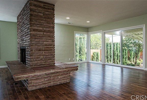 Living room with picturesque windows.