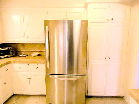 ROOM FOR LARGE REFRIGERATOR AND DOUBLE DOOR PANTRY