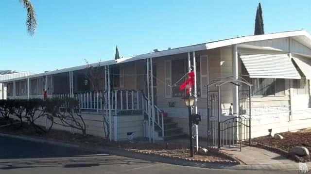 Great corner lot in a FAMILY MOBILE HOME PARK !  Large 2 bedroom, 1-3/4 bath home with family room and formal dining area. An additional enclosed patio room of Apx.  8' X 31' provides additional square footage as well as an ideal 'Hobby' area!