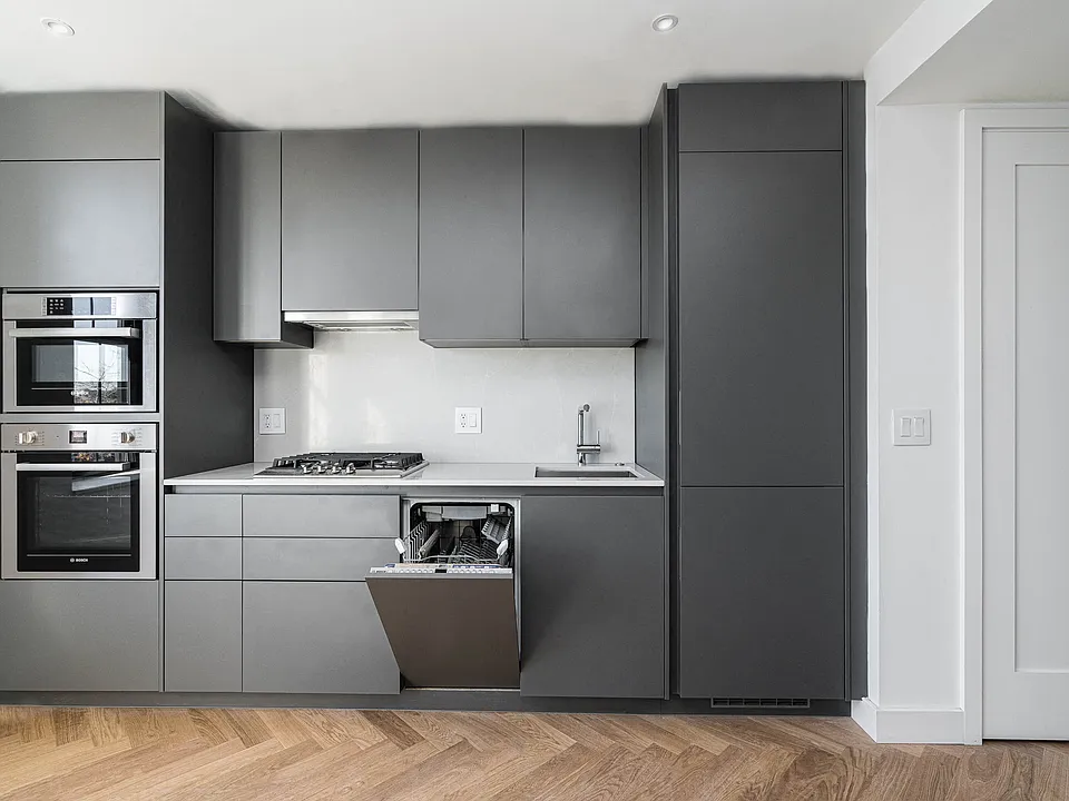 The Stanton studio kitchen with dishwasher and integrated appliances