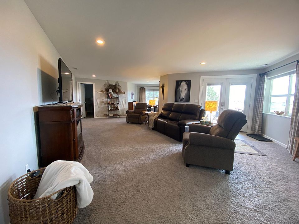Living room with French door entrance to unit.