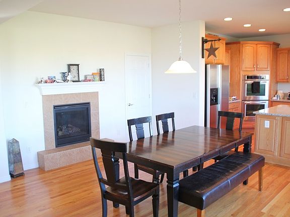 Eating area, pantry, and fireplace