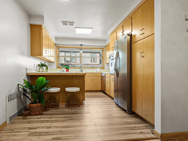 Shot straight into the kitchen. All stainless or black appliances. Very large kitchen with plenty of storage. Nice view from the kitchen.
