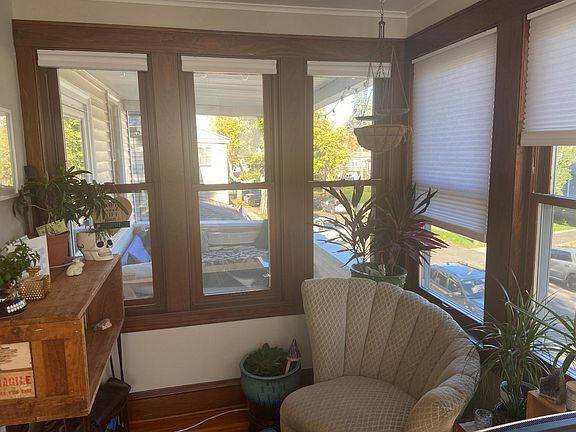 Inside porch, reading chair, windows to outside porch