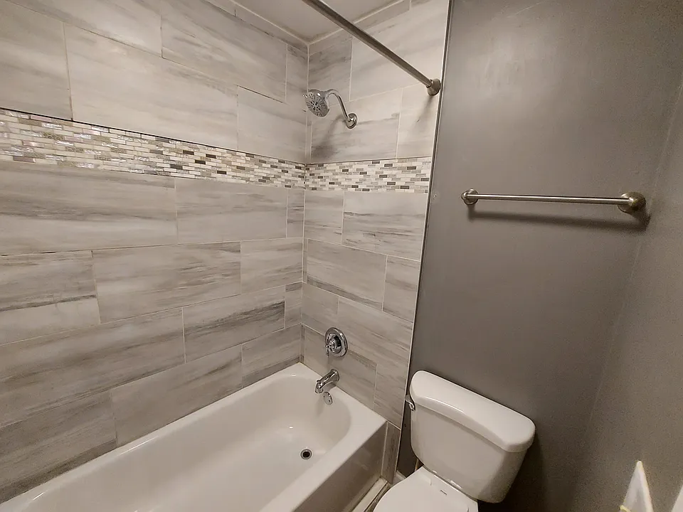 Full surround tile to the ceiling, tub, and shower.