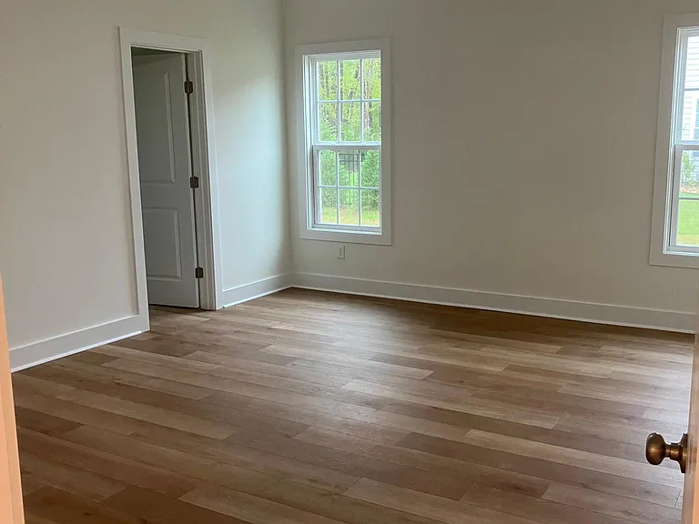 large 14x17 master bedroom with ceiling fan and lvp flooring. 9 foot ceilings throughout.