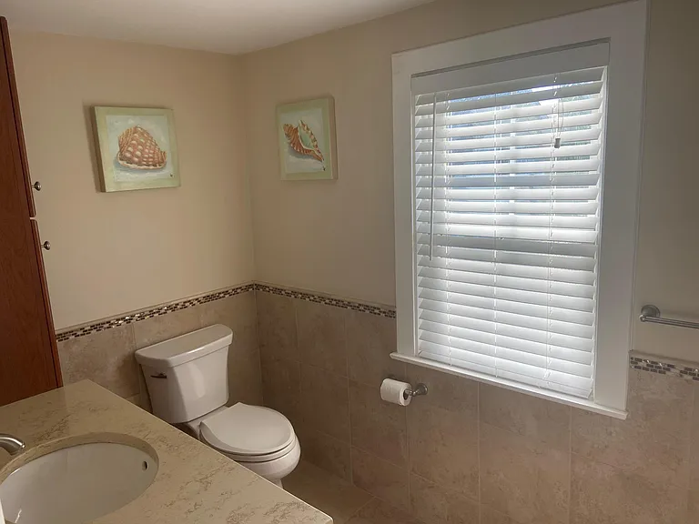 Master bedroom tiled bath with shower.