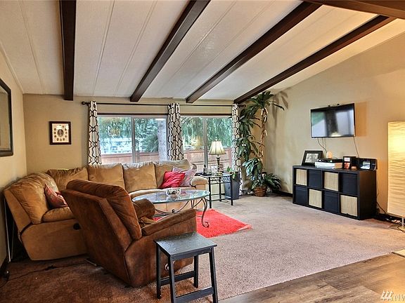 A really big living room that has plenty of room for any sectional sofa or large TV you might have!