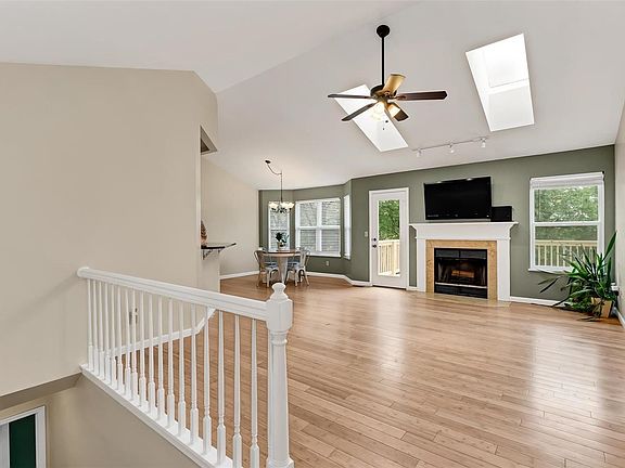 Entryway view of great room with fireplace and breakfast room.