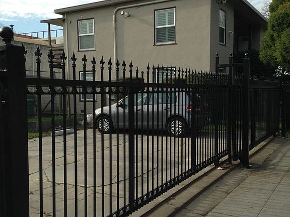 Apartment building & the Fenced Parking Area