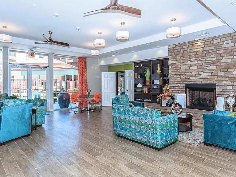 Leasing office with seating areas and view of pool