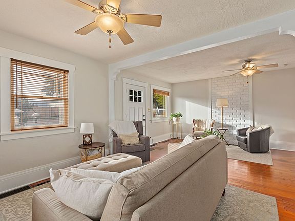 Fans have been replaced with natural fiber lighting. Floors have been refinished and are a natural aged fir look.