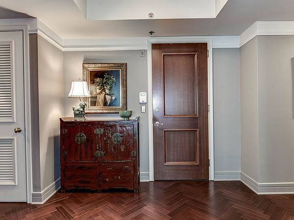 Open Foyer with beautiful herringbone patterned wood floors
