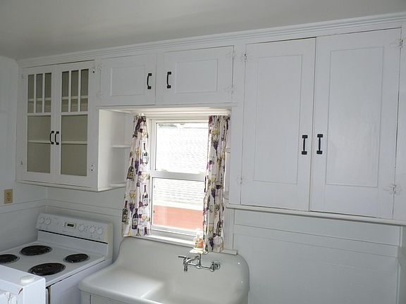 Retro Kitchen with Porcelain tile flooring