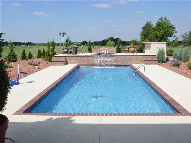 heated inground fiberglass poolw/ 2 waterfalls, 12 person spa